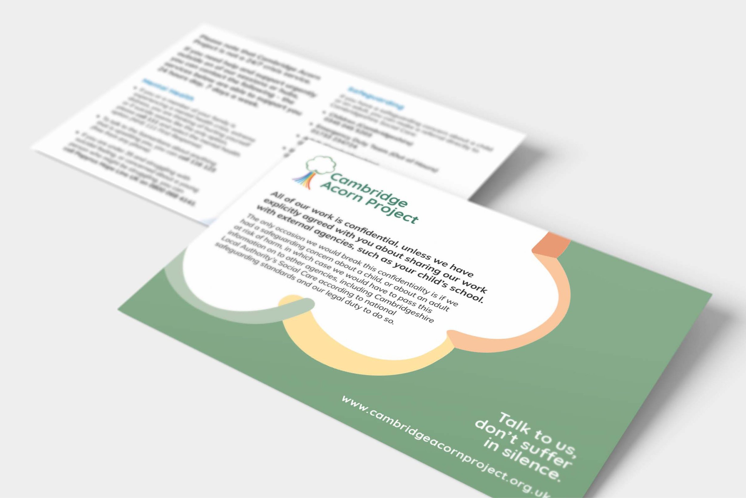 A brochure for the Cambridge Acorn Project with the organization's logo, logo, and a statement about confidentiality and child protection, along with a website URL and a message encouraging people to talk and not suffer in silence.