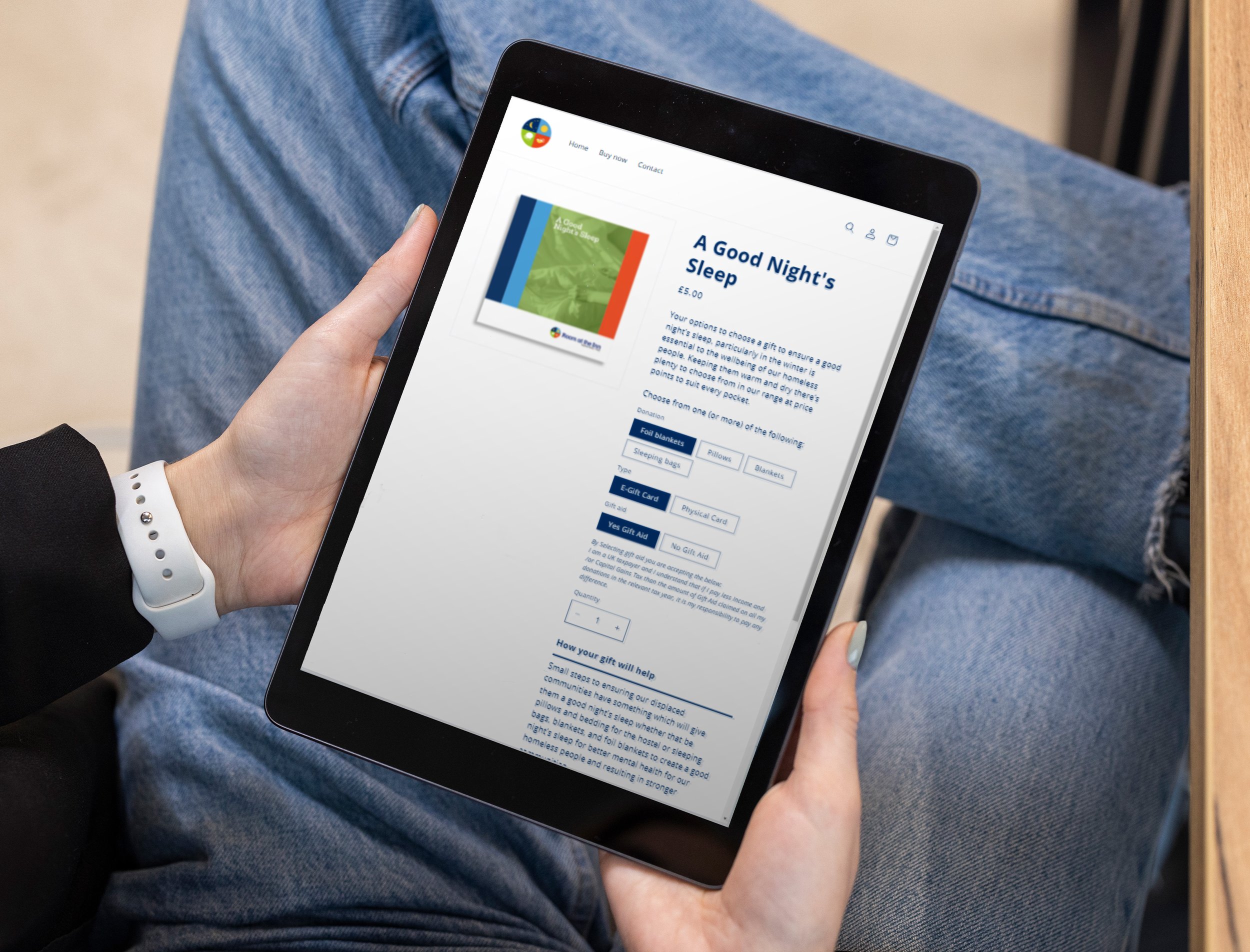 Person holding a tablet displaying an online purchase page for a book titled "A Good Night's Sleep."